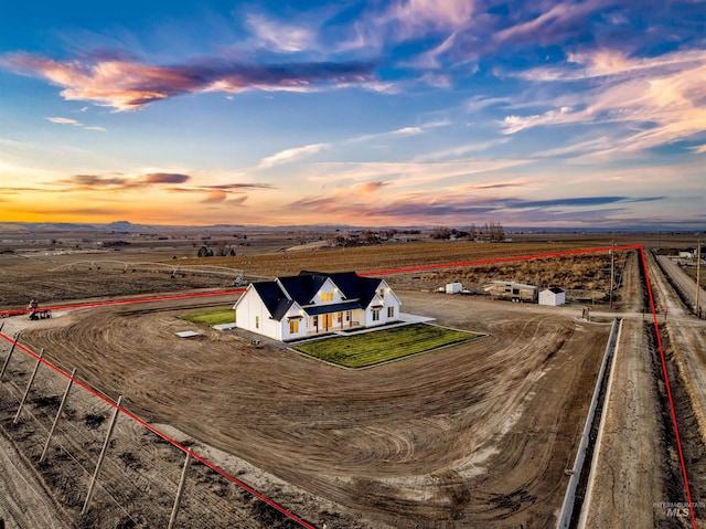 aerial view at dusk with a rural view