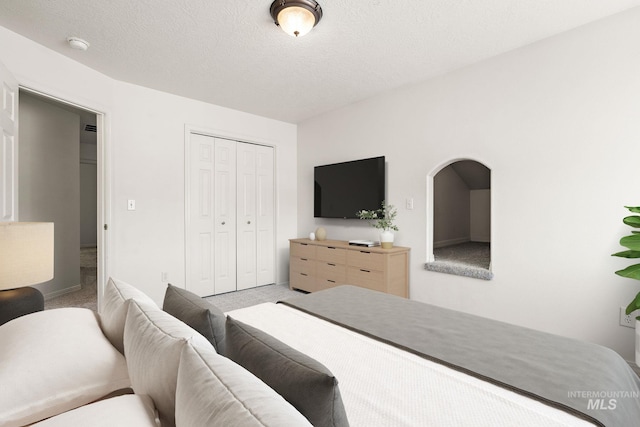 carpeted bedroom with a closet