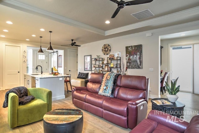 living area with recessed lighting, visible vents, ceiling fan, and light wood-style flooring