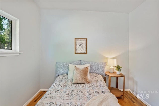 1325 E 5th N, Mountain Home, ID 83647 - bedroom featuring wood finished floors and baseboards