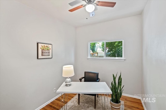 1325 E 5th N, Mountain Home, ID 83647 - office featuring baseboards, wood finished floors, and ceiling fan