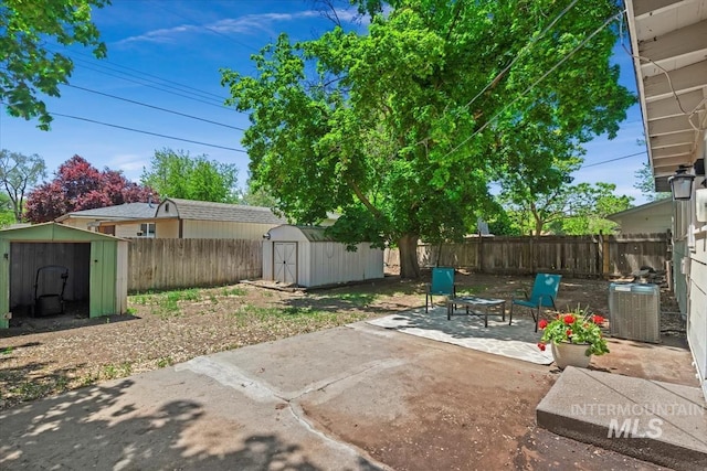 1325 E 5th N, Mountain Home, ID 83647 - fenced backyard featuring a patio area and central air condition unit