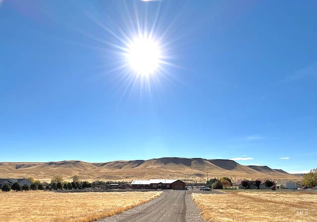 view of mountain feature with a rural view