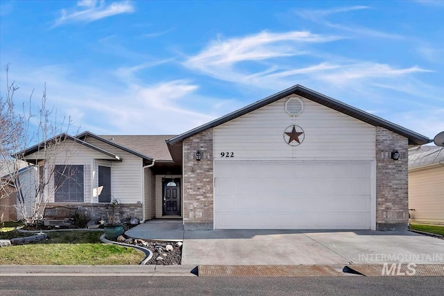 ranch-style house featuring a garage