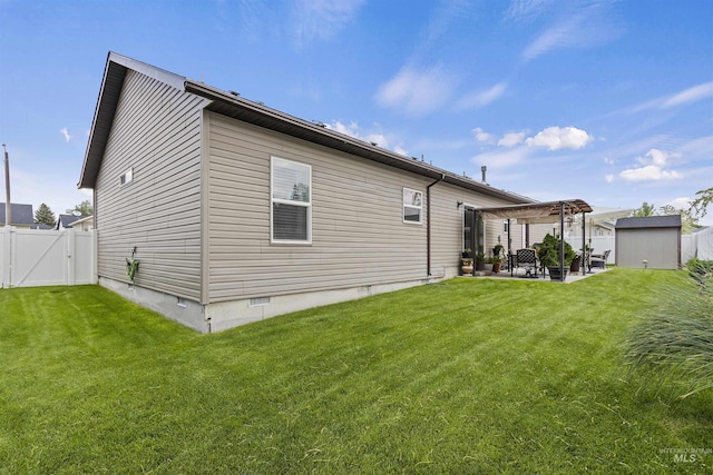 1011 Lynx, Jerome, ID 83338 - back of property with a patio, crawl space, a fenced backyard, a gate, and a storage unit