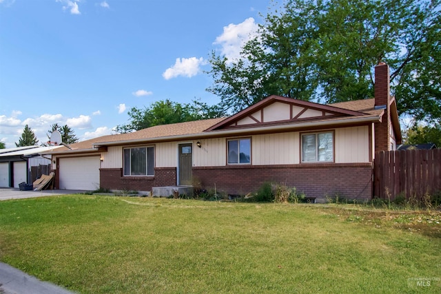 view of front of house with a front lawn and a garage