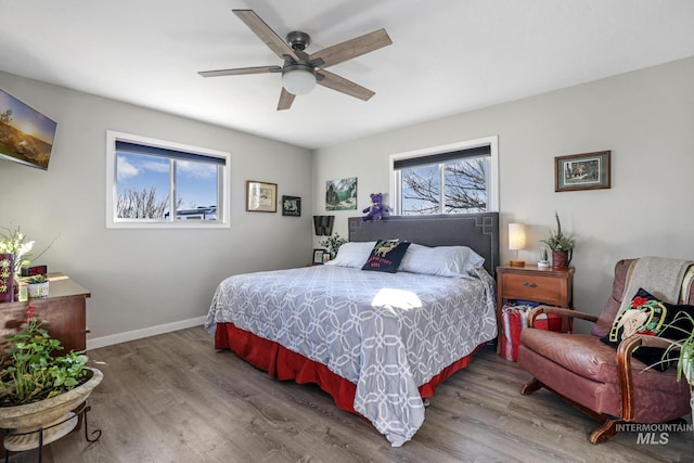 bedroom featuring hardwood / wood-style flooring and ceiling fan