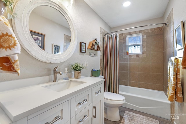 full bathroom with vanity, toilet, and shower / bath combo with shower curtain