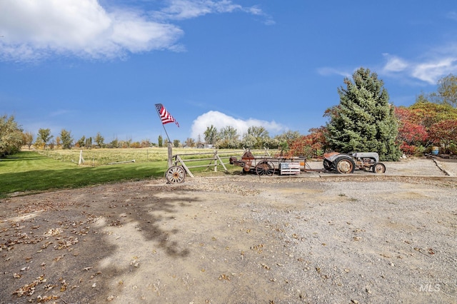 view of yard with a rural view
