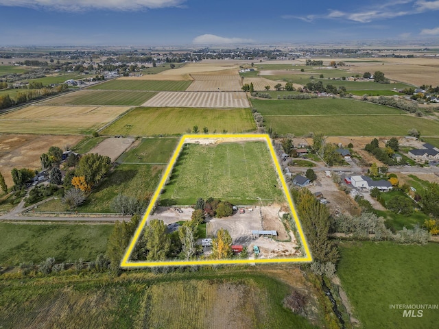 birds eye view of property with a rural view