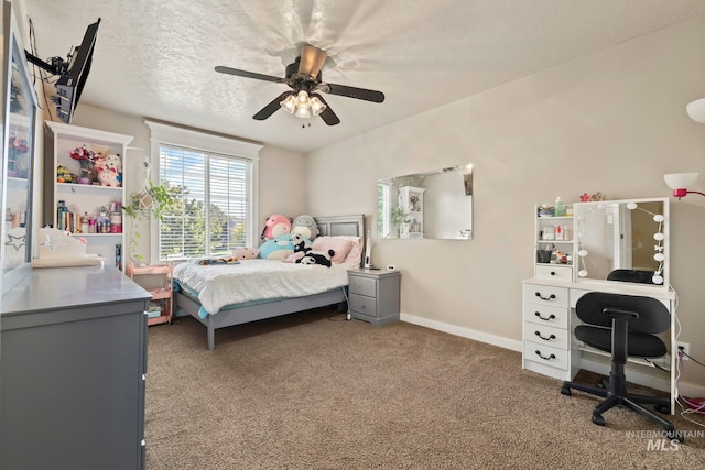 bedroom with carpet, a textured ceiling, and ceiling fan