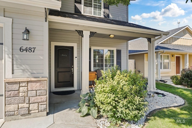 entrance to property featuring a porch