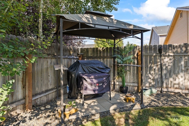 view of patio / terrace featuring a gazebo and area for grilling