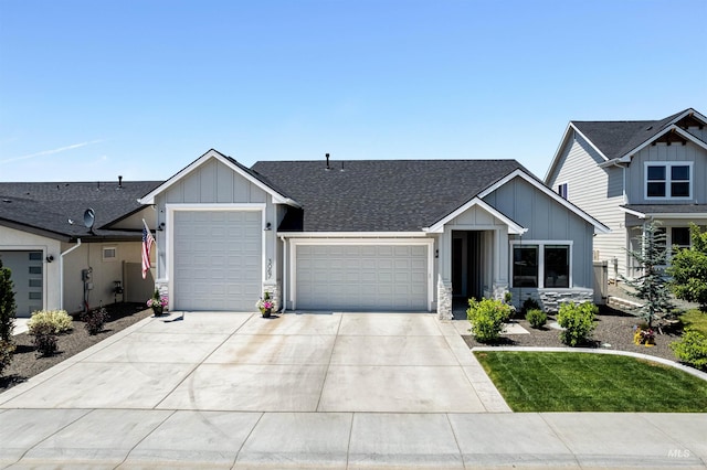 3067 N Sun City Ave, Star, ID 83669 - view of front of property featuring board and batten siding, a garage, driveway, roof with shingles, and stone siding