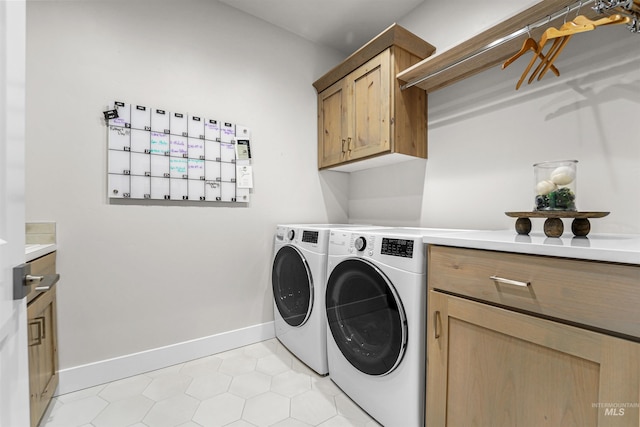3067 N Sun City Ave, Star, ID 83669 - washroom featuring cabinet space, washer and dryer, and light tile patterned flooring
