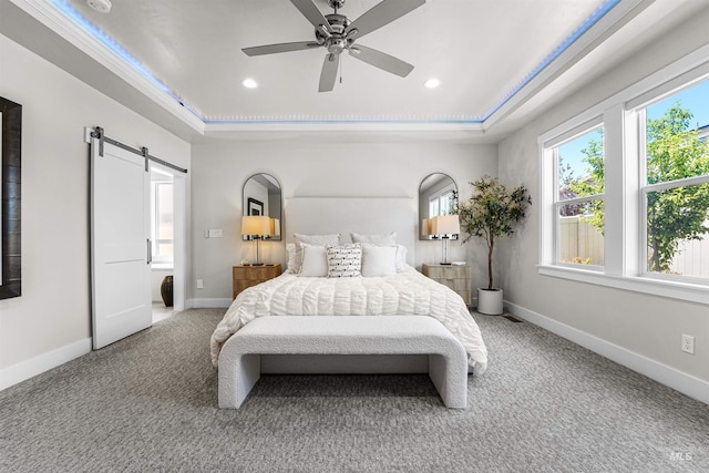 3067 N Sun City Ave, Star, ID 83669 - bedroom featuring a raised ceiling, a barn door, carpet flooring, recessed lighting, and ceiling fan