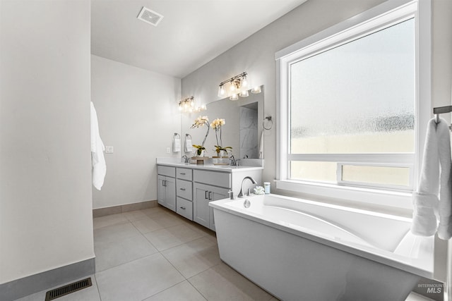 3067 N Sun City Ave, Star, ID 83669 - full bath featuring double vanity, a tub to relax in, and tile patterned floors
