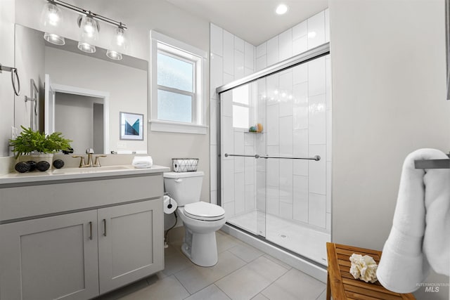 3067 N Sun City Ave, Star, ID 83669 - bathroom with a stall shower, vanity, tile patterned flooring, and recessed lighting