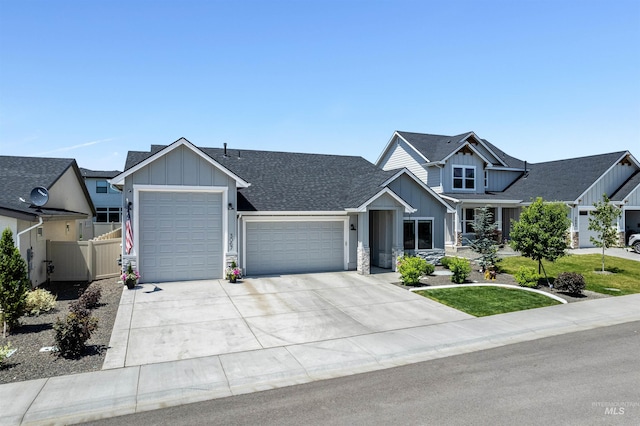 3067 N Sun City Ave, Star, ID 83669 - craftsman-style house with board and batten siding, an attached garage, concrete driveway, and roof with shingles