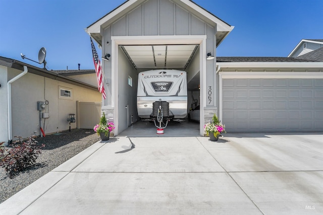 3067 N Sun City Ave, Star, ID 83669 - view of front of house with board and batten siding, driveway, and a garage
