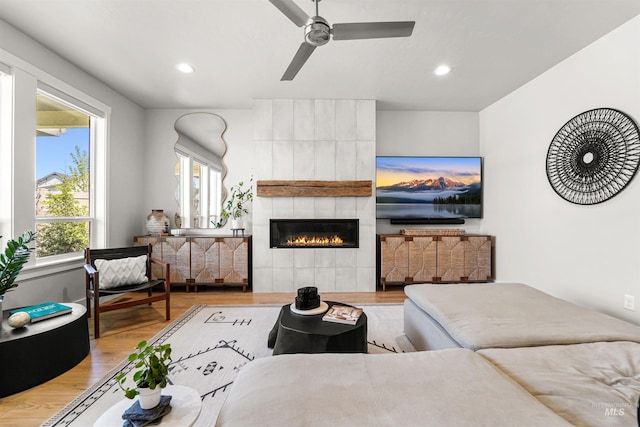 3067 N Sun City Ave, Star, ID 83669 - living room with plenty of natural light, wood finished floors, recessed lighting, a fireplace, and a ceiling fan