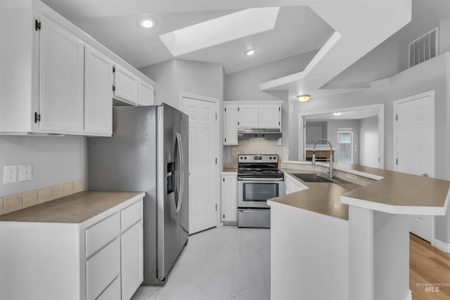 4104 Iris Ct, Nampa, ID 83687 - kitchen featuring stainless steel appliances, a sink, under cabinet range hood, white cabinets, and recessed lighting