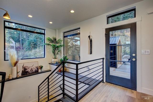 interior space with recessed lighting and wood finished floors