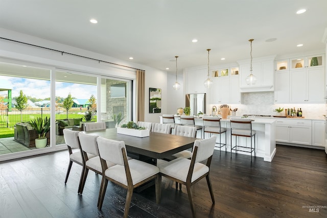 dining space with dark wood-type flooring