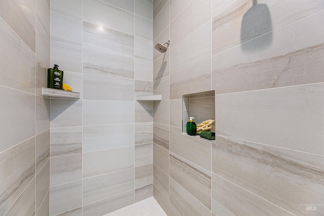 bathroom with tiled shower