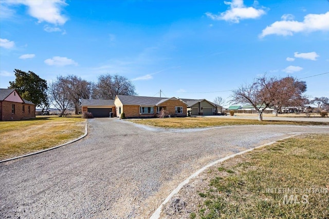 ranch-style home with a front yard