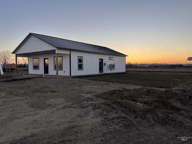 exterior space featuring metal roof