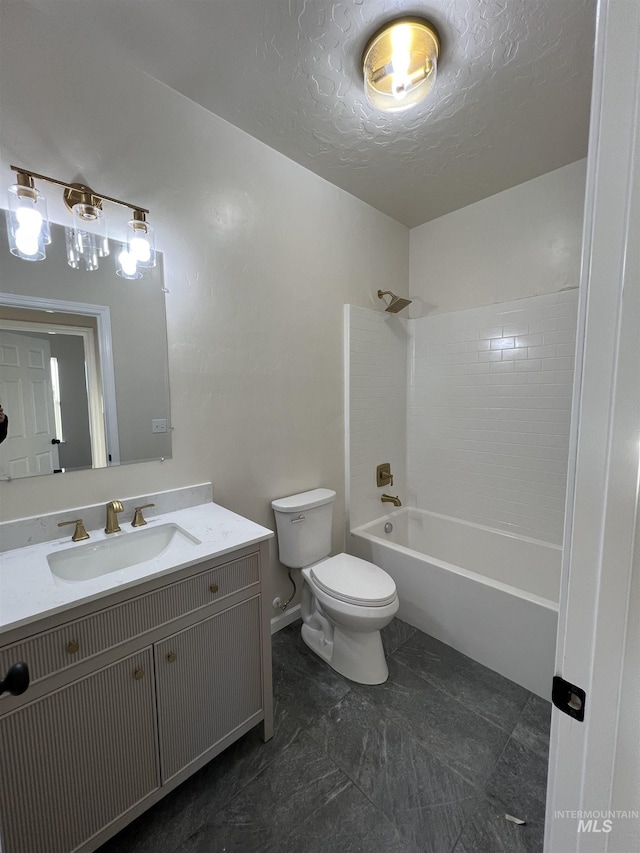 full bathroom with a textured ceiling, shower / washtub combination, vanity, and toilet