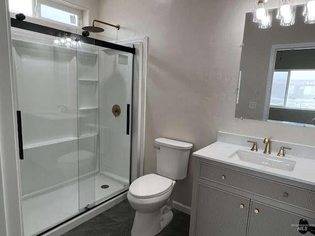 full bath featuring toilet, a stall shower, and vanity