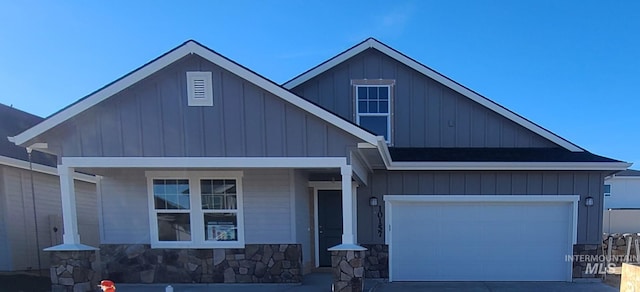 447 S Jake Ave, Kuna, ID 83634 - craftsman-style home featuring board and batten siding, concrete driveway, a porch, and stone siding