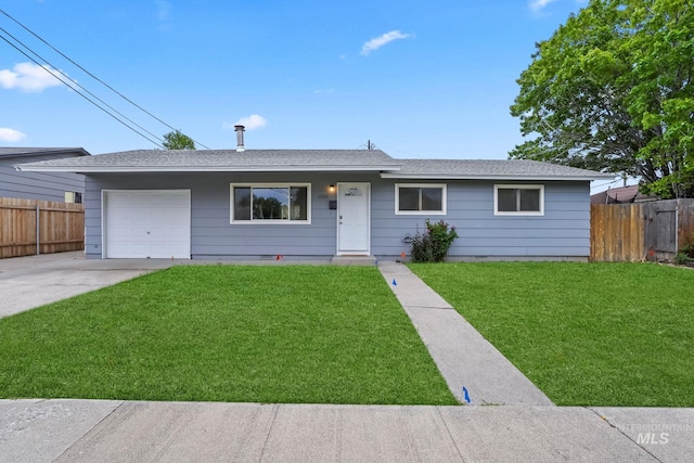 ranch-style home featuring an attached garage, fence, driveway, and a front lawn