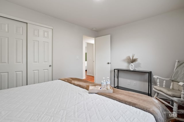 bedroom featuring a closet and baseboards