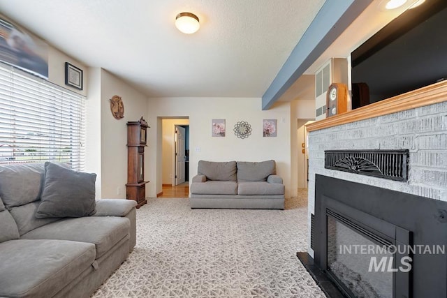 1015 E Park, Weiser, ID 83672 - living room with a fireplace and carpet floors