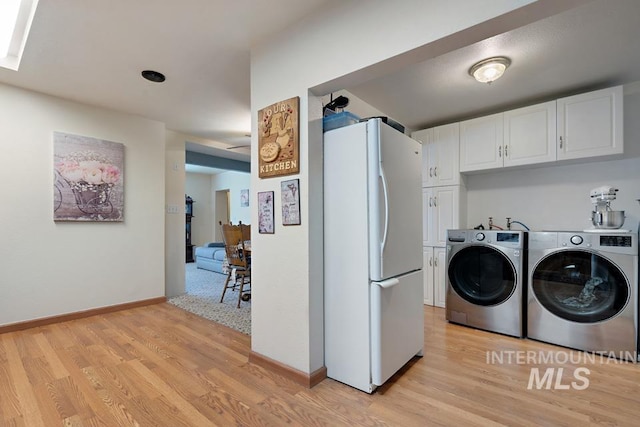 1015 E Park, Weiser, ID 83672 - laundry area featuring separate washer and dryer and light wood-style floors