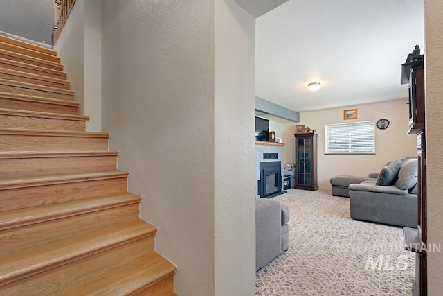 1015 E Park, Weiser, ID 83672 - staircase with a fireplace and carpet floors