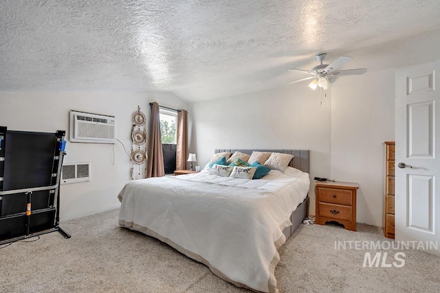1015 E Park, Weiser, ID 83672 - carpeted bedroom with lofted ceiling, a textured ceiling, an AC wall unit, and ceiling fan