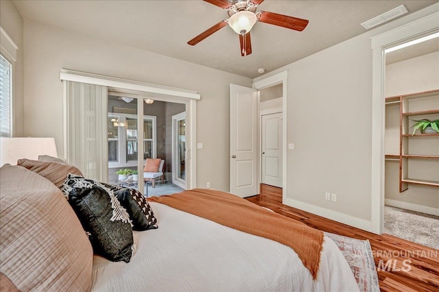1512 N 28th St, Boise, ID 83703 - bedroom featuring access to exterior, wood finished floors, and baseboards