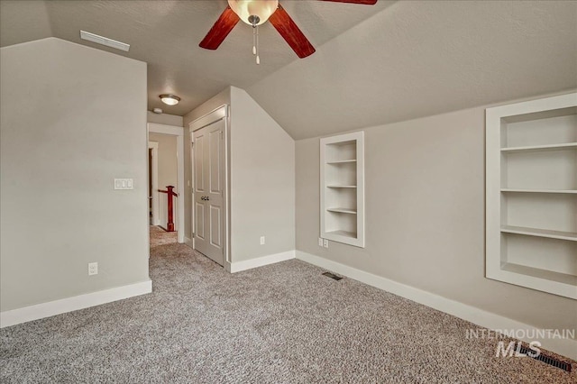 1512 N 28th St, Boise, ID 83703 - additional living space with built in shelves, baseboards, carpet, a ceiling fan, and lofted ceiling