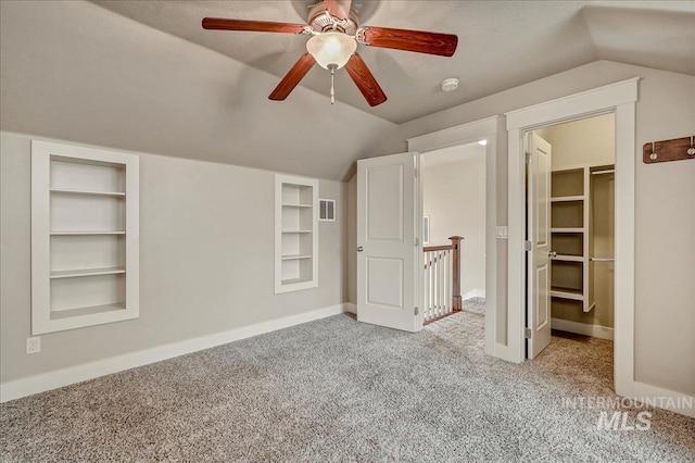 1512 N 28th St, Boise, ID 83703 - unfurnished bedroom with vaulted ceiling, carpet floors, a spacious closet, baseboards, and a ceiling fan