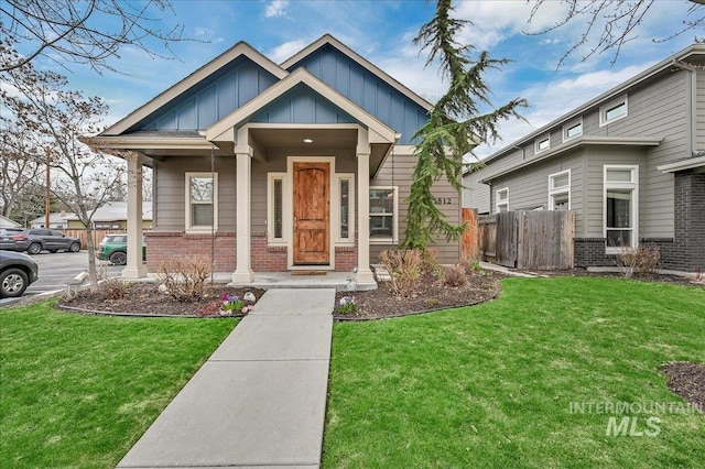 1512 N 28th St, Boise, ID 83703 - view of front of property featuring brick siding, board and batten siding, and a porch