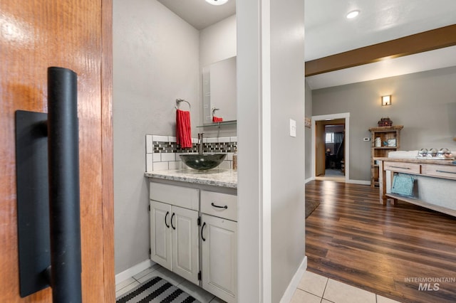 bathroom with tile patterned floors and vanity