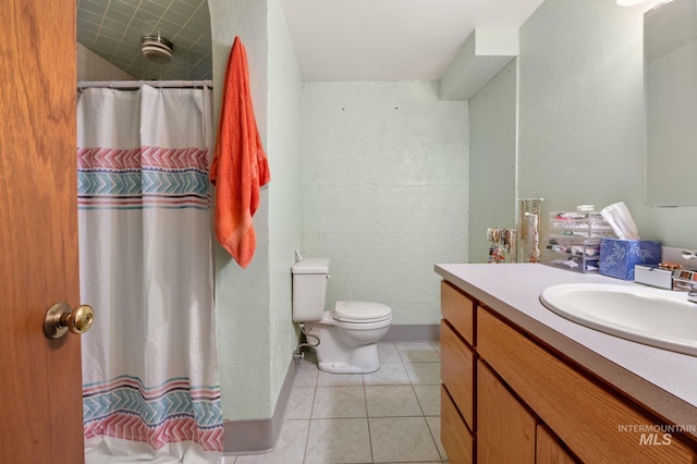 bathroom with walk in shower, tile patterned flooring, vanity, and toilet