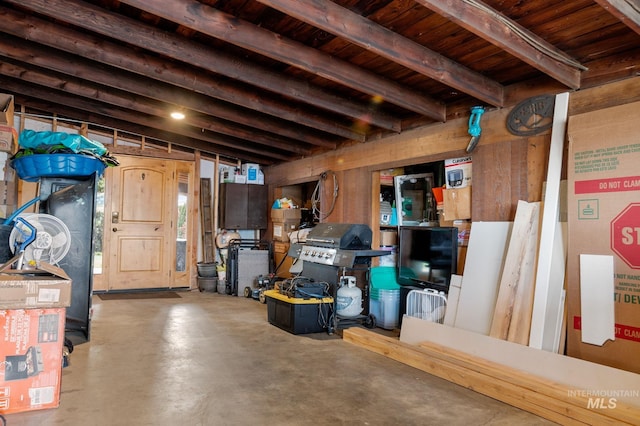 basement with wooden walls and wood ceiling