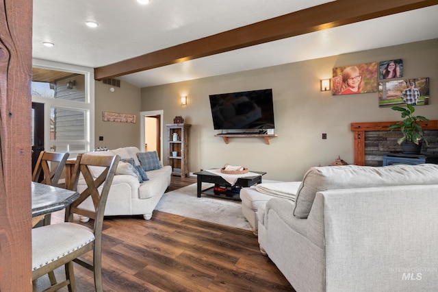 living room featuring beam ceiling and dark hardwood / wood-style flooring