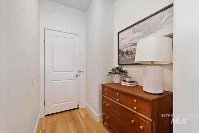 entryway with light wood-style floors and baseboards
