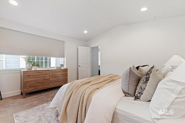 bedroom with recessed lighting, vaulted ceiling, carpet, and visible vents